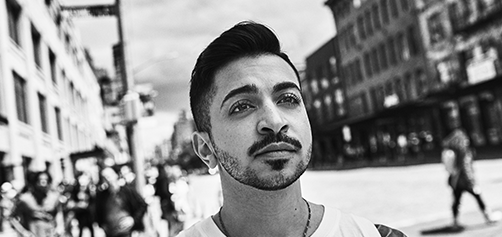 Man standing outside in an urban area